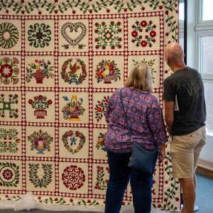 Huge colourful quilt being admired at Showcase